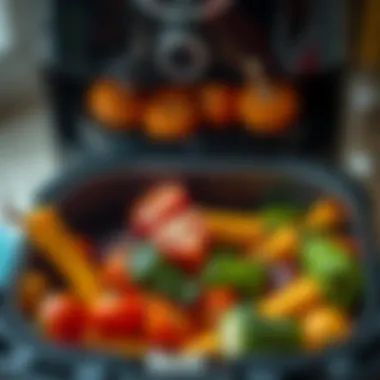 Air fryer filled with colorful vegetables ready for cooking