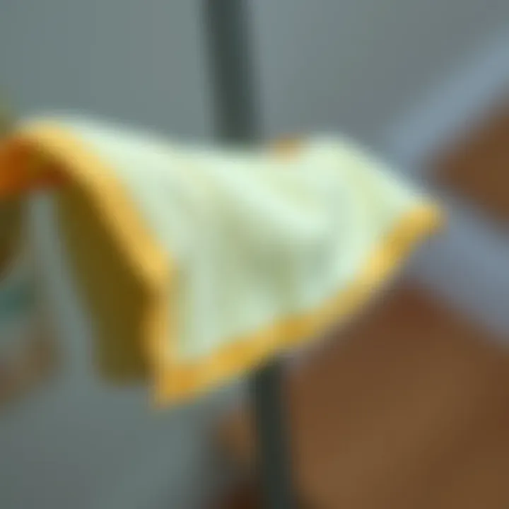 Close-up of a microfiber cloth gliding over a glass surface