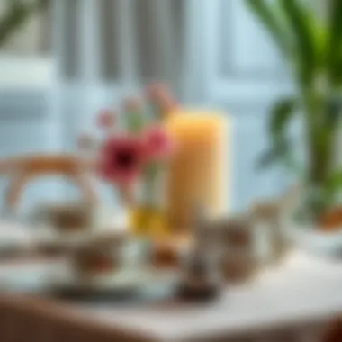 A beautifully set table with tea cups and a teapot.