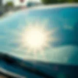A pristine car windshield reflecting sunlight