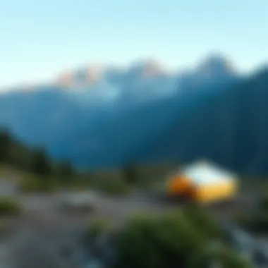 Serene landscape of a camping site surrounded by mountains